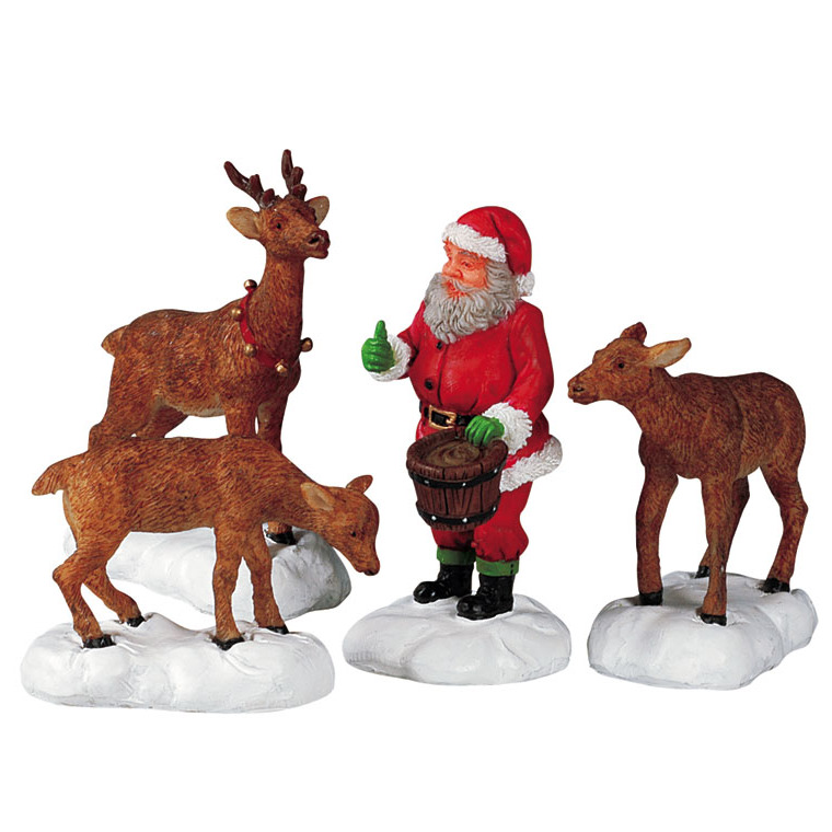 Figurine Père Noël nourrissant les rennes 16.5 x 4 x 7 cm