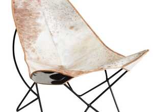 Fauteuil en métal et peau de vache Fauteuil en métal et peau de vache