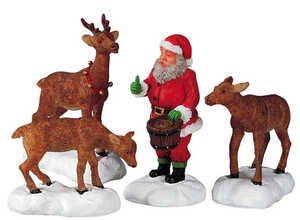 Figurine Père Noël nourrissant les rennes 16.5 x 4 x 7 cm